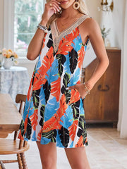 A-line dress with tropical leaf print, V-neck, crochet trim, and pockets.