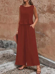 Burgundy ruffled peplum top and wide-leg pants set with pockets.