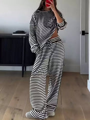 Black and white striped pajama set with drawstring pants and long sleeve top.