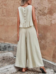 Beige ruffled peplum top with button back and wide-leg pants set