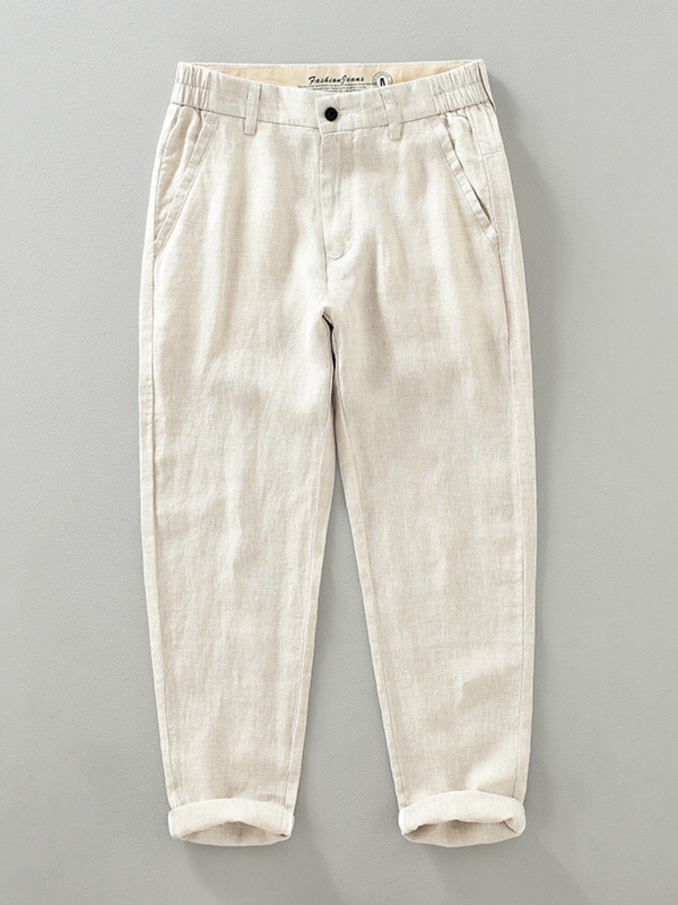 Men's raw hemp color linen cropped sweatpants with elastic waistband and cuffed hems.