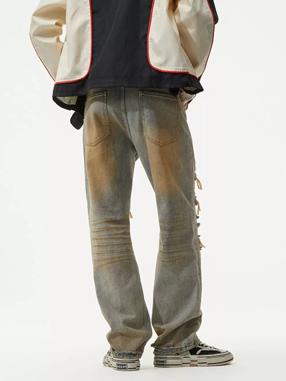Men's distressed jeans with unique wash and ripped details.
