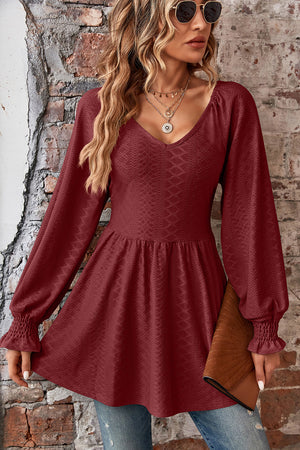 Burgundy textured empire waist blouse with shirred sleeves and v-neck