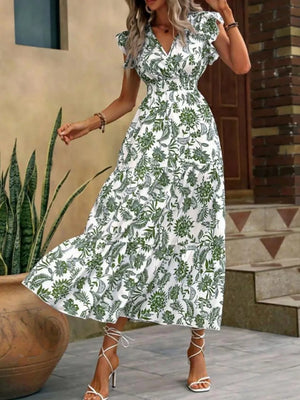Botanical ruffle sleeve midi dress in white with green print, V-neck, smocked waist, tiered skirt.