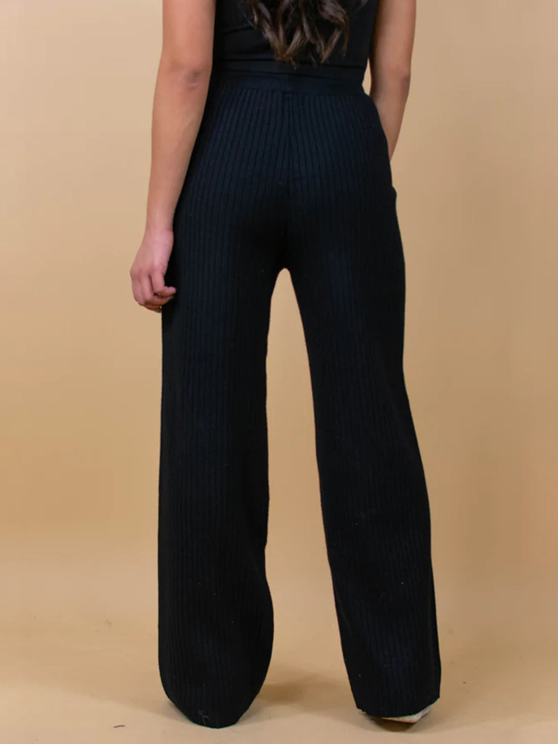 Black ribbed knit palazzo trousers with a wide leg