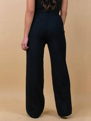 Black ribbed knit palazzo trousers with a wide leg