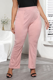 Dusty pink flare leg trousers with sculpted seams and a high waist.