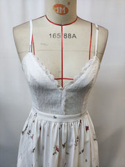 White floral lace trim cami dress with spaghetti straps and a V-neck.
