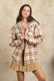 Cozy plaid shacket in Camel with sherpa hood and button front detail.
