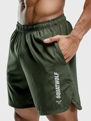 Performance shorts in army green with split hem and white logo detail