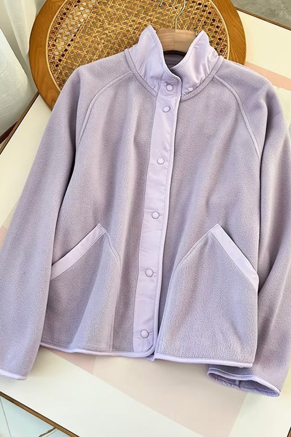 Pink Purple fleece bomber jacket with contrast trim and snap button closure.