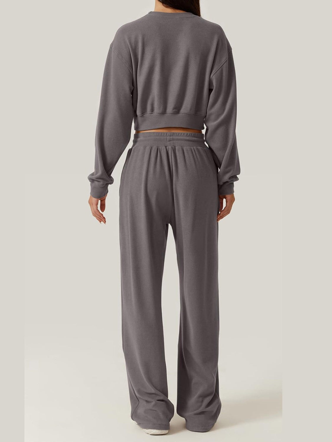 Dark gray knit lounge set with cropped sweatshirt and wide-leg pants