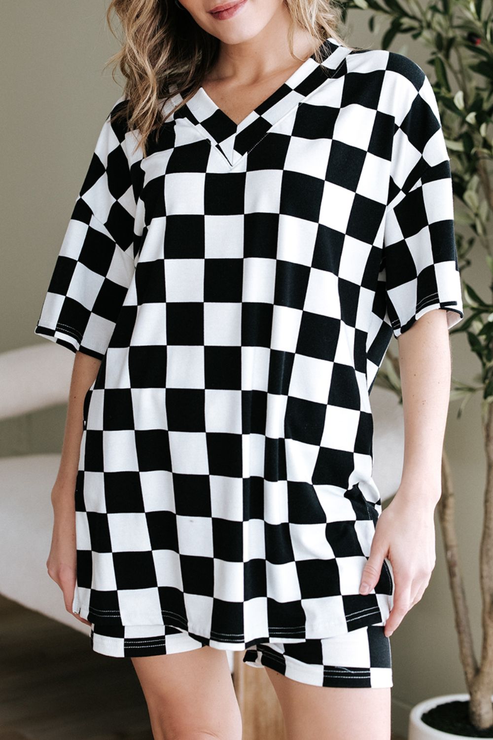 Black and white checkered v-neck t-shirt and shorts outfit set