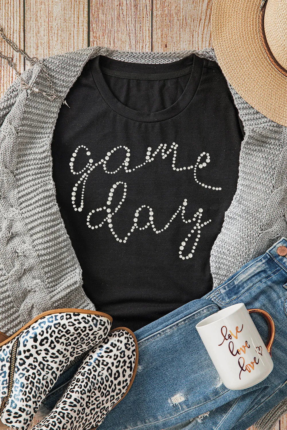 Black t-shirt with white dot "Game Day" graphic, crew neck, short sleeves.