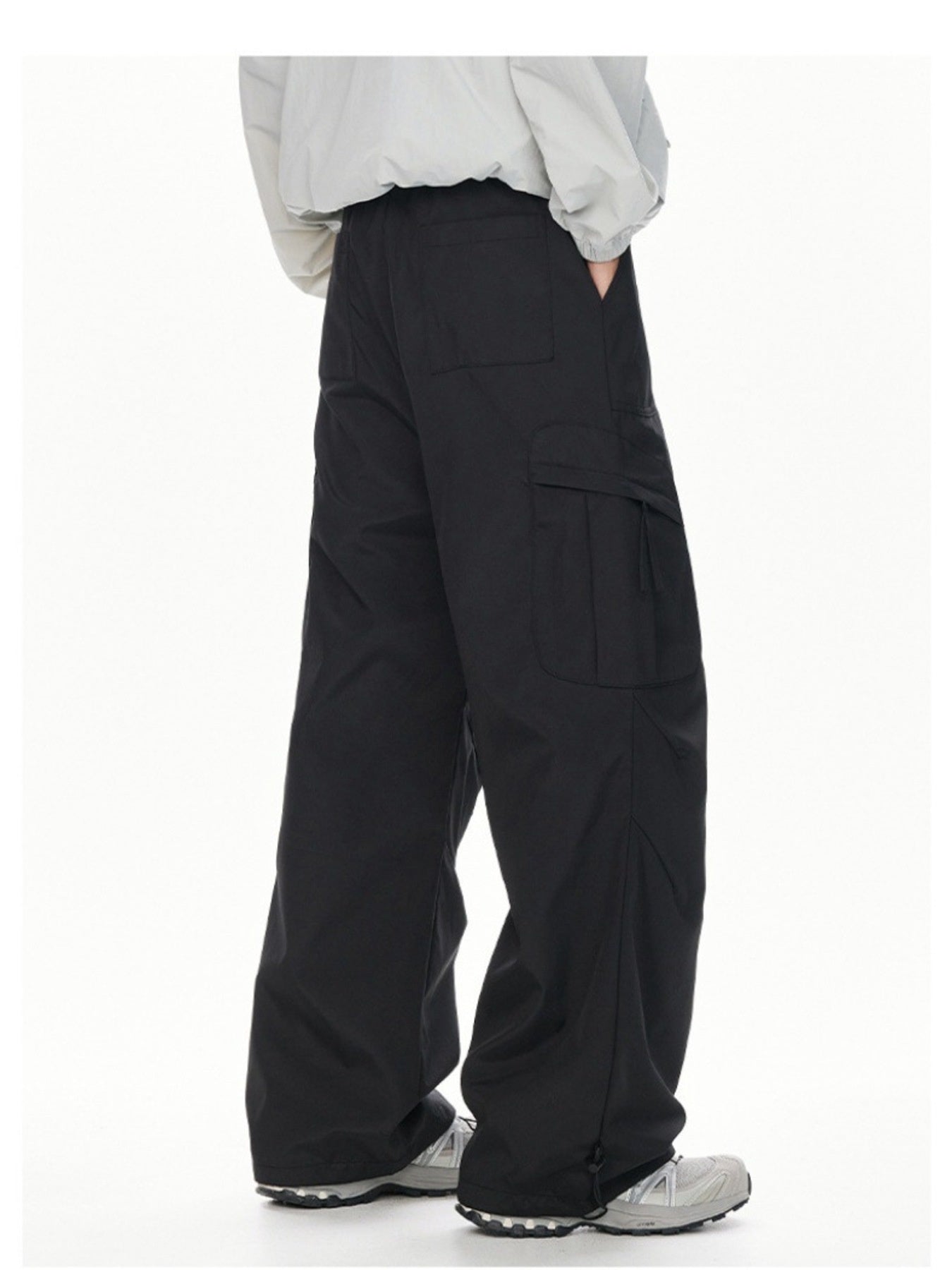 Men's black relaxed fit cargo sweatpants with adjustable drawstring hem.