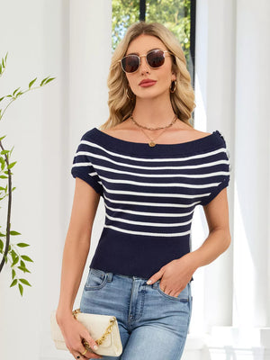Chic navy and white striped knit sweater with decorative shoulder buttons and off-the-shoulder neckline.