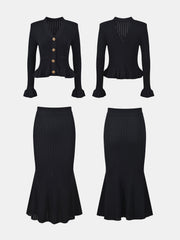 Black knit cardigan with ruffled hem and gold buttons, paired with a matching ribbed midi skirt.