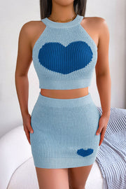 Sky blue knit halter crop top and mini skirt set with intarsia heart detail.