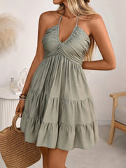 Olive green ruched halter tiered mini dress with ruffles and a V-neckline.