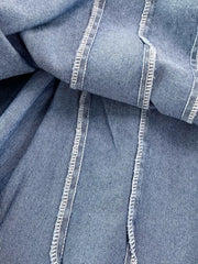 Blue denim A-line dress with corset detail and white contrast stitching.