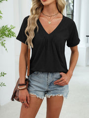Black ruched V-neck short sleeve t-shirt with elastane, styled with denim shorts.