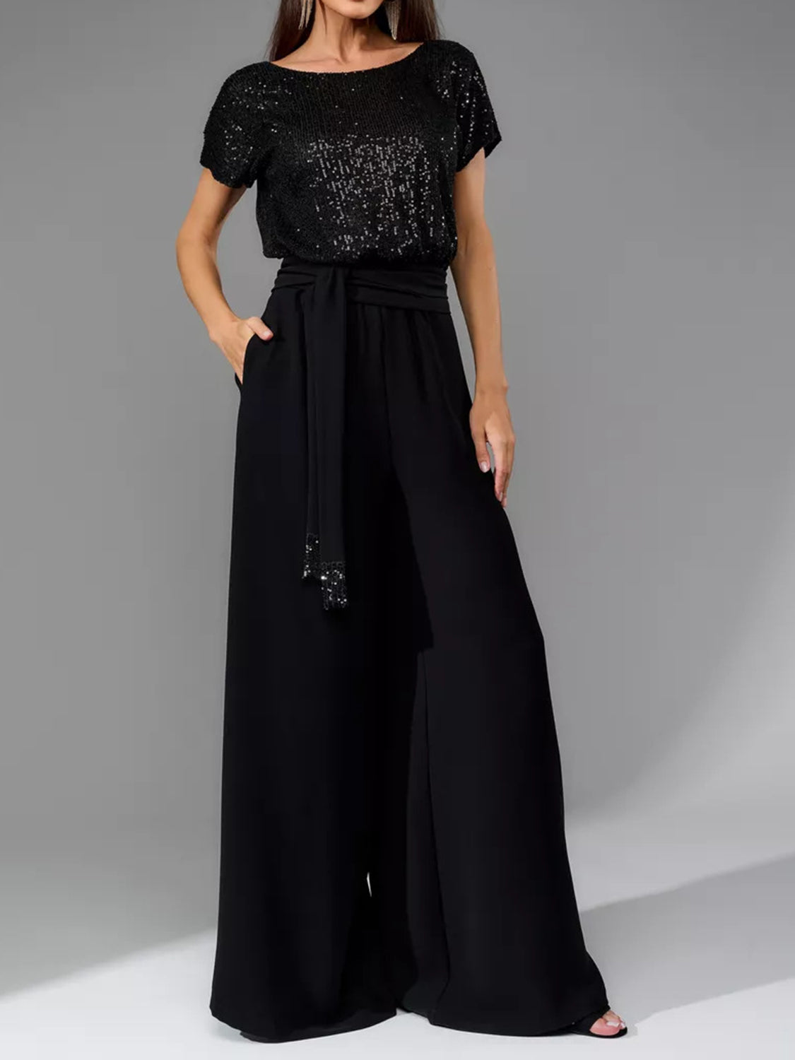 Black sequin short sleeve bodice with a belted palazzo pant ensemble.