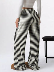 Striped ribbed wide-leg pants with drawstring in black and white.