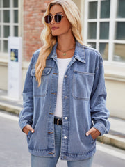 Oversized denim shacket in medium blue wash with button-down front and chest pockets.