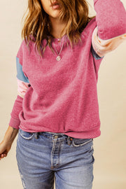 Dusty pink pullover sweatshirt with color block sleeves and crew neck.