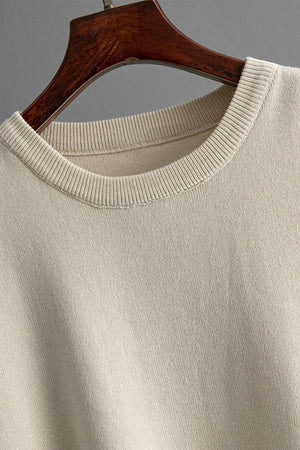 Cream acrylic round neck top with ribbed collar detail