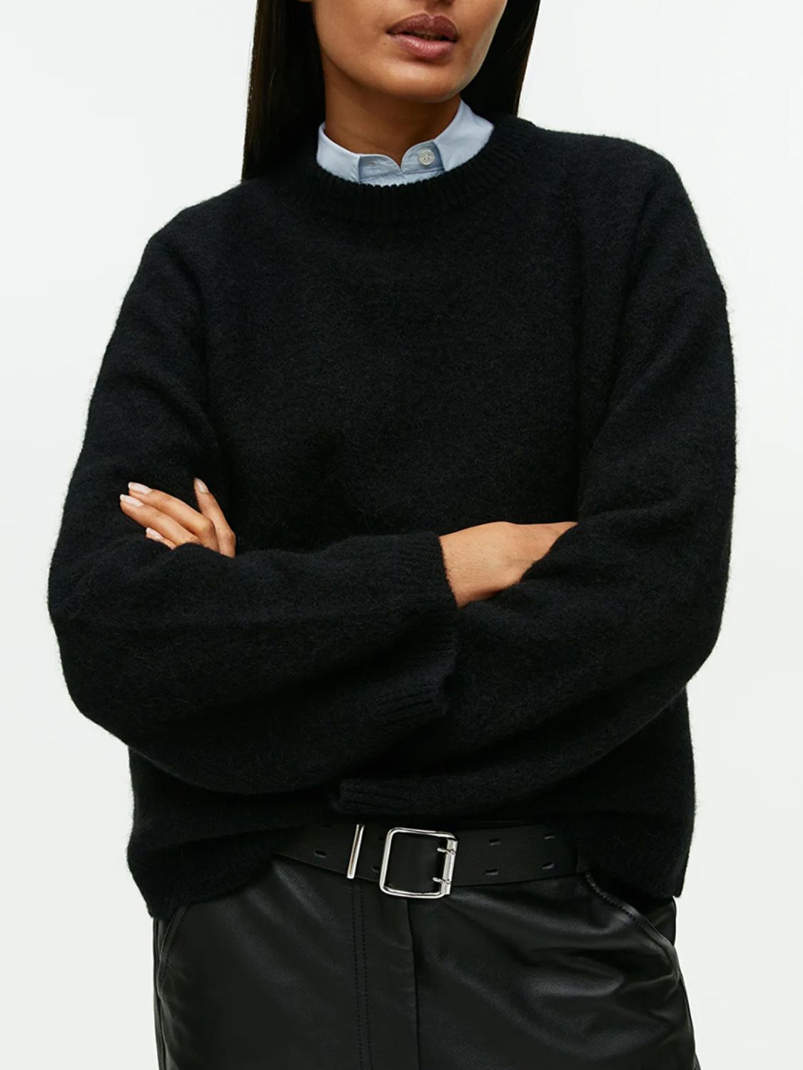 Black oversized brushed knit crewneck sweater with a textured finish.