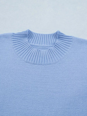 Light blue ribbed knit top with ruffled round neck