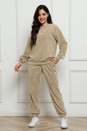 Beige corduroy lounge set with crew neck sweatshirt and jogger pants, featuring a chest pocket.