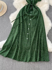 Green polka dot maxi dress with button front and tie belt.
