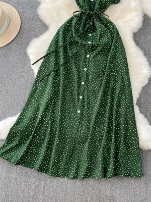 Green polka dot maxi dress with button front and tie belt.