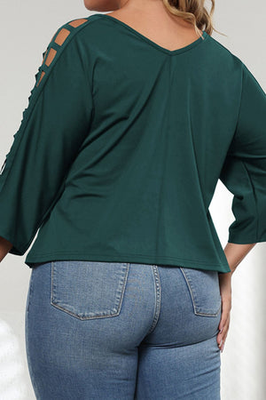 Forest green V-neck blouse with lattice detail on the sleeves.