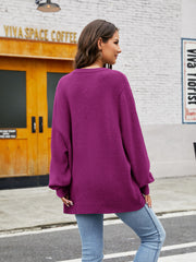 Fuchsia balloon sleeve crewneck knit sweater with ribbed cuffs and hem.