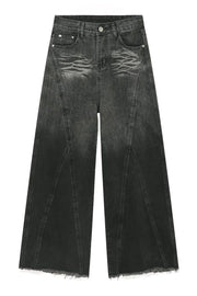 Dark denim palazzo trousers with a wide leg, distressed detailing, and frayed hem.