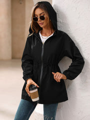 Black hooded technical jacket with cinched waistline and zipper closure