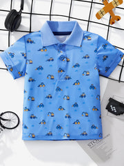 Toddler blue polo shirt with allover excavator print, short sleeves, and button placket.