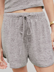 Gray ribbed knit lounge shorts with drawstring waist and elastic waistband.