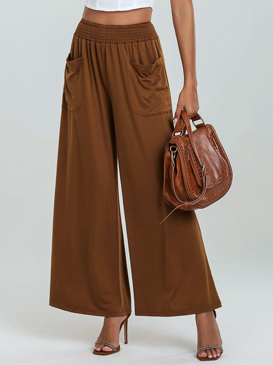 Caramel elastic waist palazzo trousers with pockets and wide legs.