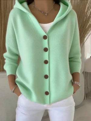 Light green knit hooded cardigan with button front and brown buttons.
