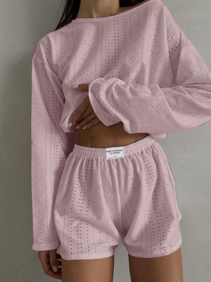 Blush pink perforated crop top and shorts set with long sleeves and elastic waistband.