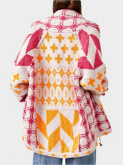 Geometric patchwork knit cardigan with multicolor patterns and buttoned front.