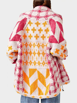 Geometric patchwork knit cardigan with multicolor patterns and buttoned front.