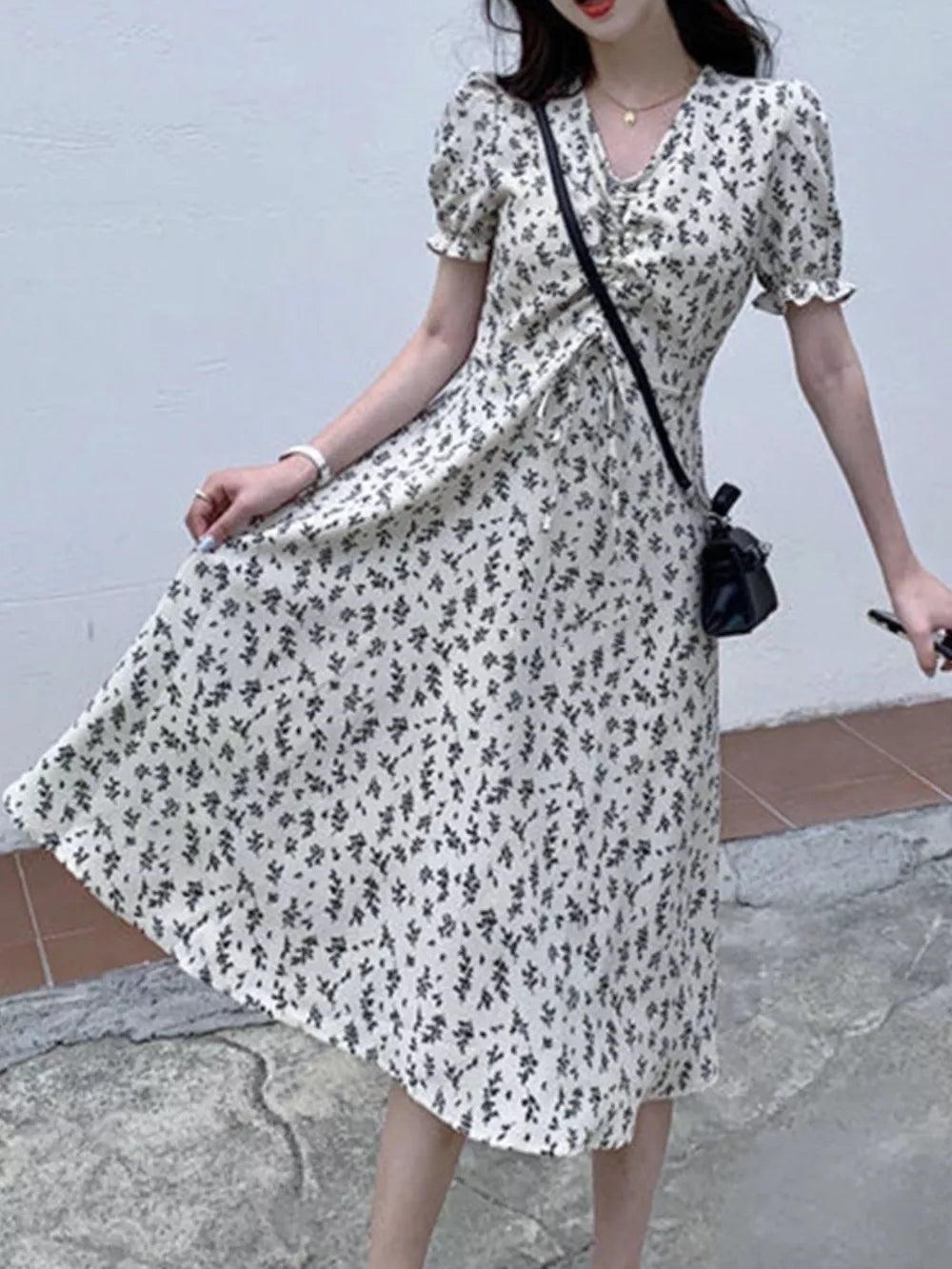 White botanical print midi dress with puff sleeves and drawstring waist