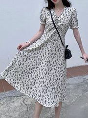 White botanical print midi dress with puff sleeves and drawstring waist