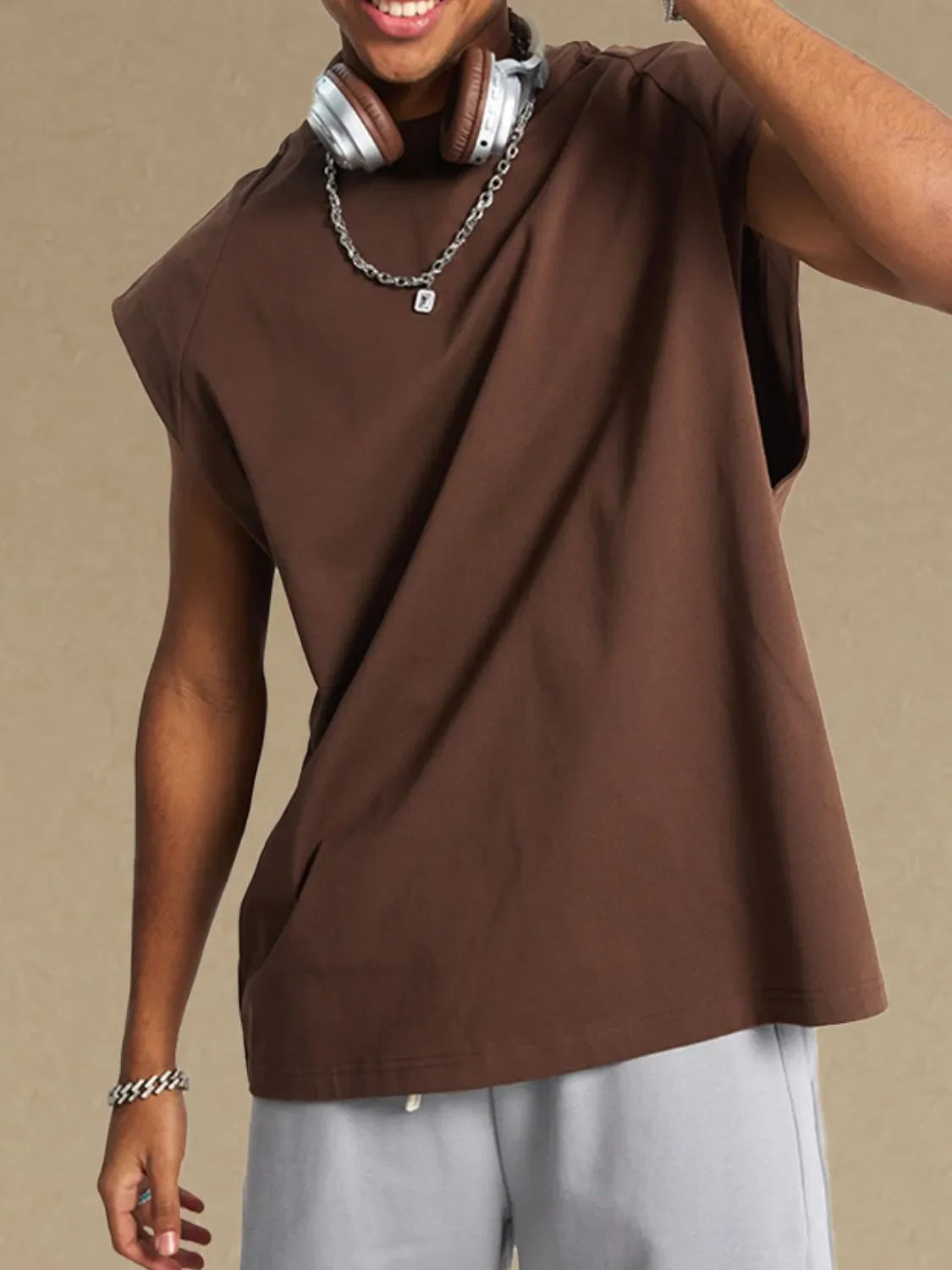 Brown raglan shoulder sleeveless top with a relaxed fit.