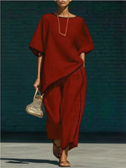 Burgundy two-piece set with contrast trim, half sleeves, and wide-leg pants.